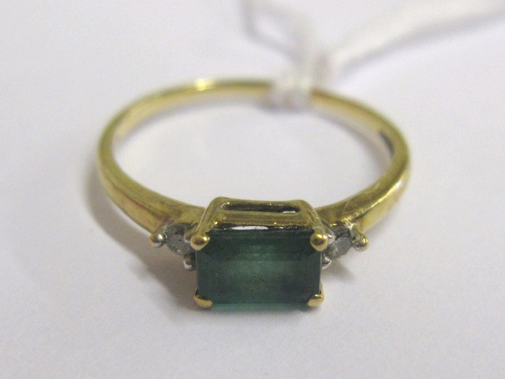 Appraisal: Gold step cut emerald ring with diamond set shouders