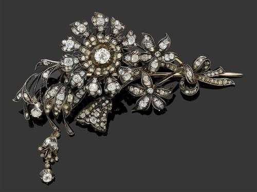 Appraisal: DIAMOND BROOCH ca Silver over red gold Charming brooch in