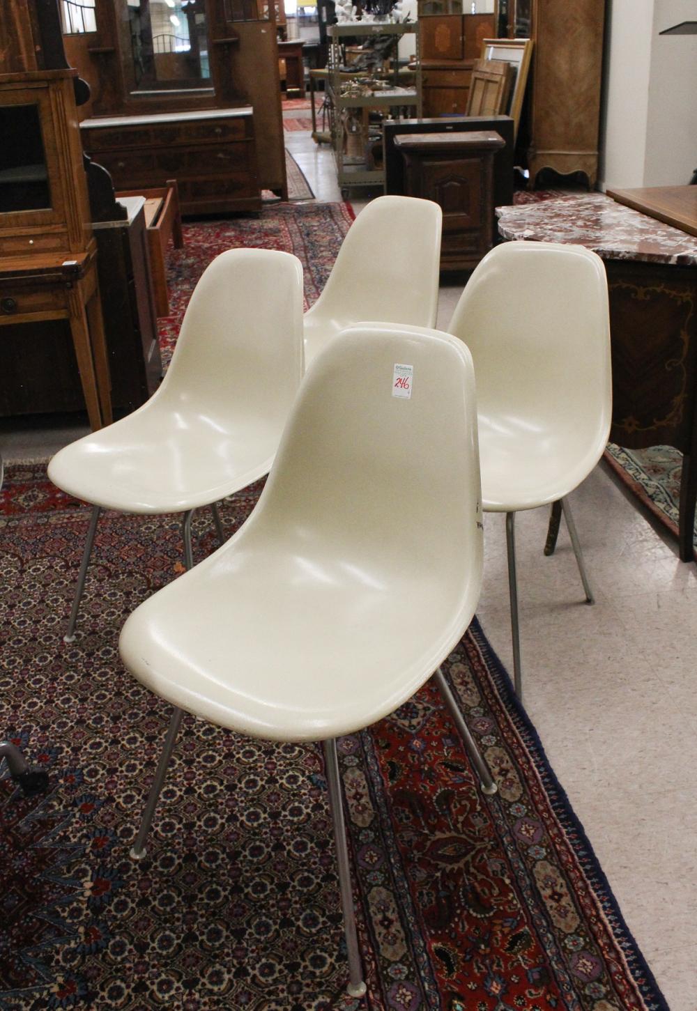 Appraisal: SET OF FOUR EAMES MOLDED FIBERGLASS SHELL CHAIRS Charles Ray