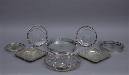 Appraisal: GROUP OF EIGHT SILVER-RIMMED AND SILVER-PLATED GLASS TRAYS Comprising a