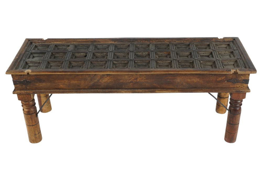 Appraisal: INDONESIAN DOOR COFFEE TABLEcarved wood top and legs with iron