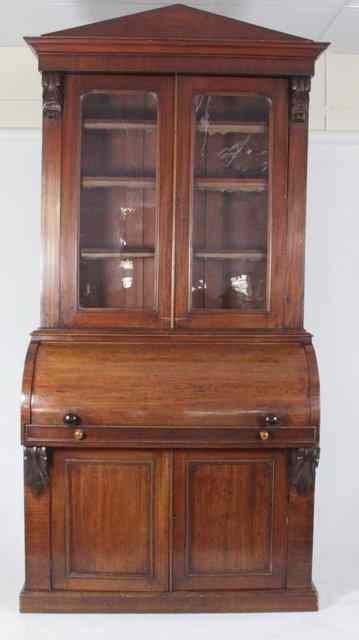 Appraisal: An early Victorian mahogany cylinder bureau the bookcase over with