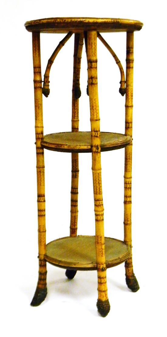 Appraisal: Bamboo type bentwood three-tiered stand woven circular top and shelves