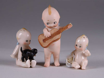 Appraisal: LOT OF KEWPIES Includes - standing Kewpie playing guitar missing