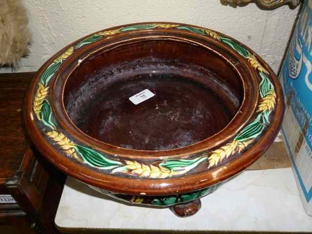 Appraisal: A TH CENTURY BROWN GLAZED MAJOLICA CIRCULAR DISH with wheat