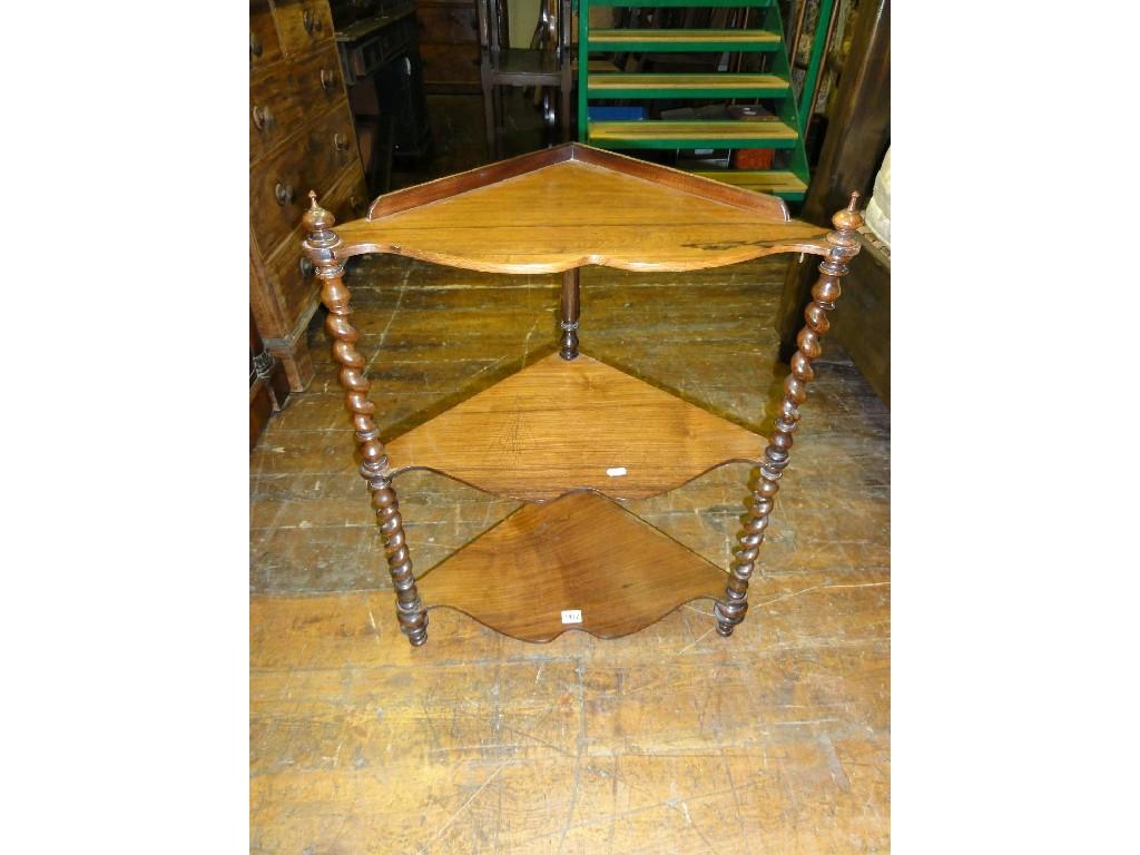 Appraisal: A Victorian rosewood three tier free standing corner what not