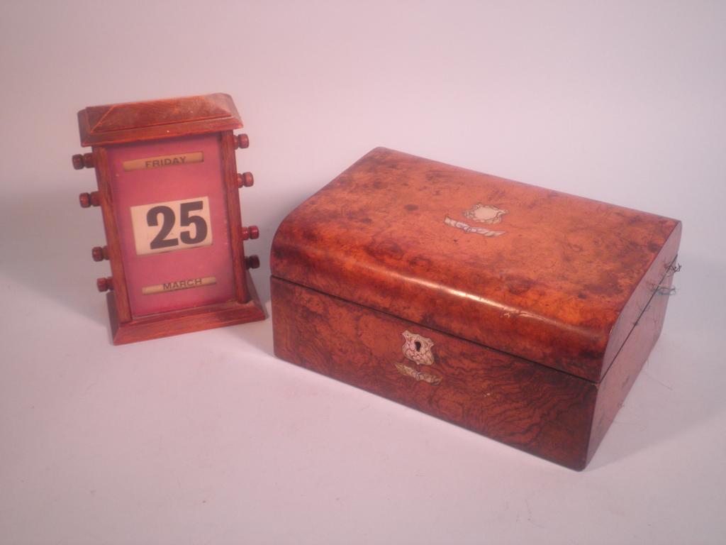 Appraisal: A Victorian dome top workbox with a mother of pearl