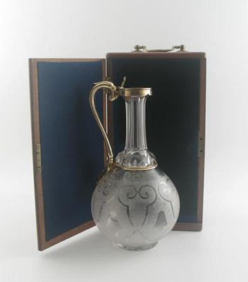 Appraisal: A Victorian silvergilt mounted clear glass claret jug with a