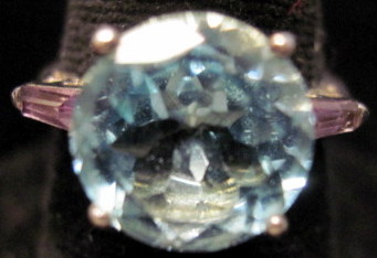 Appraisal: Sterling silver and topaz rings ingle round cut blue topaz