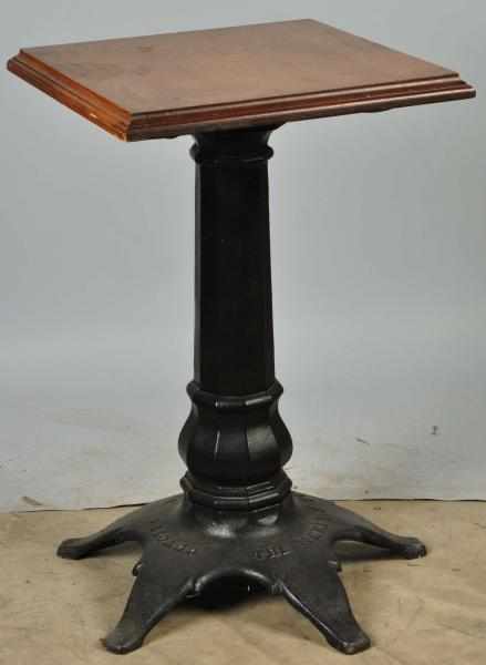 Appraisal: Cast Iron Merle Heaney Slot Machine Stand Description Wooden top