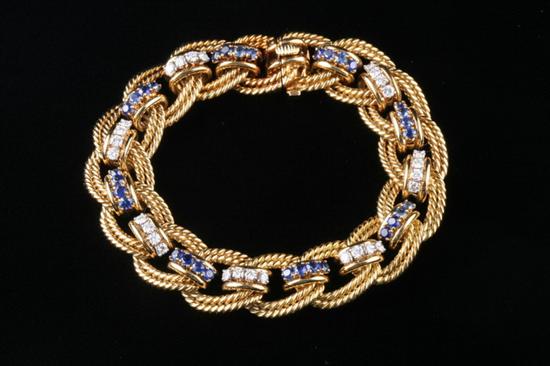 Appraisal: K YELLOW GOLD SAPPHIRE AND DIAMOND BRACELET Composed of openwork