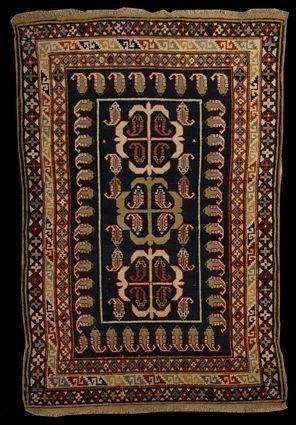 Appraisal: PERSIAN RUG The black field with lobed medallions enclosing pine