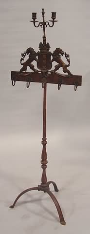 Appraisal: Tripod base supporting an octagonal pedestal accessory hooks mounted on