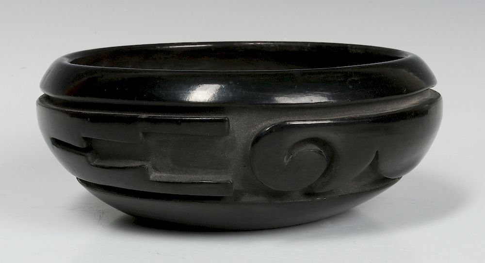 Appraisal: A DEEPLY CARVED SANTA CLARA BOWL BY S CHAVARRIA A