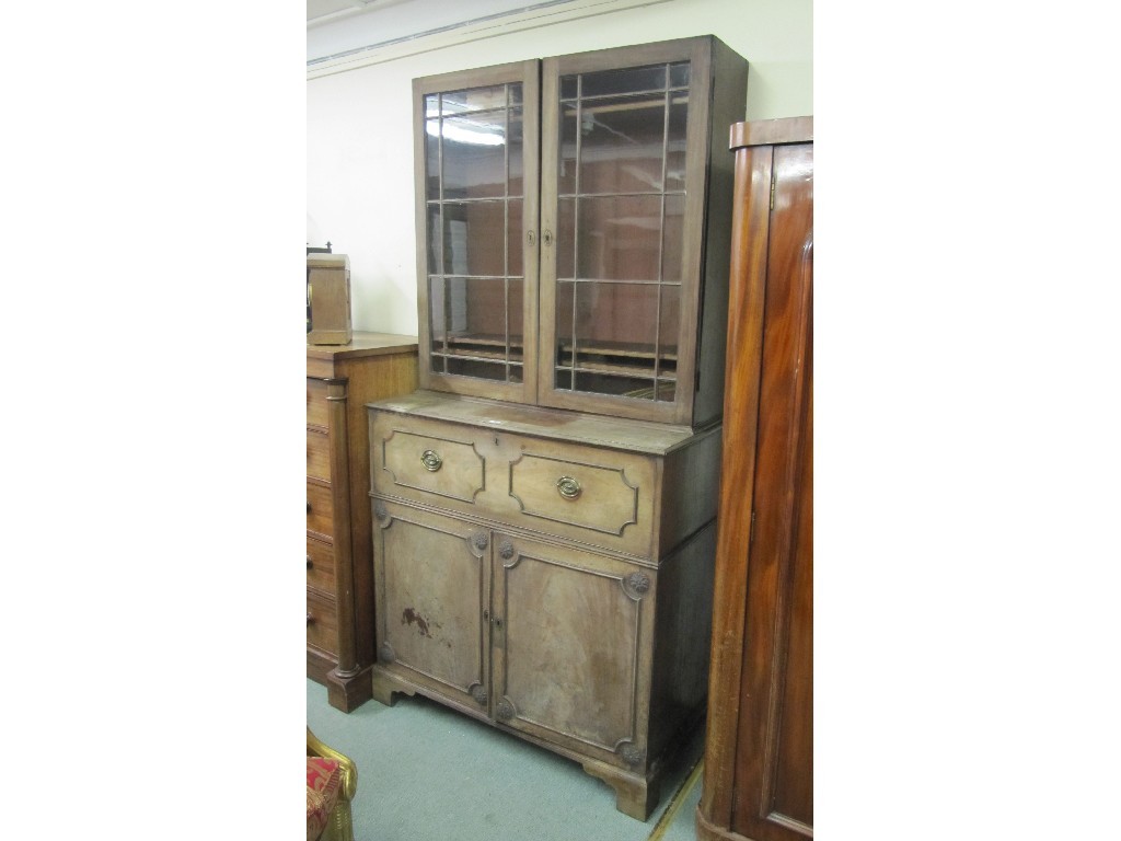 Appraisal: Regency mahogany bookcase on a secretaire cupboard