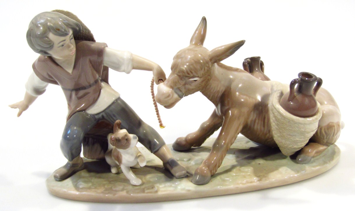 Appraisal: A Lladro Daisa figure group formed as a child pulling