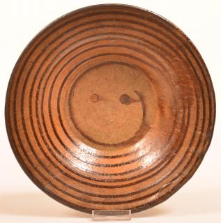 Appraisal: th Century Earthenware Pottery Bowl Manganese concentric ring glaze decoration