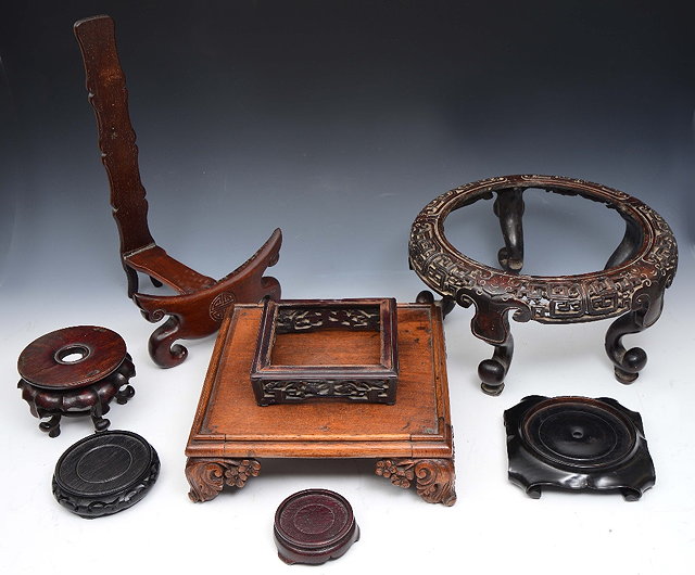 Appraisal: A COLLECTION OF EIGHT CHINESE HARDWOOD STANDS including a large