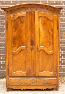 Appraisal: A th Century French provincial walnut armoire enclosed by a