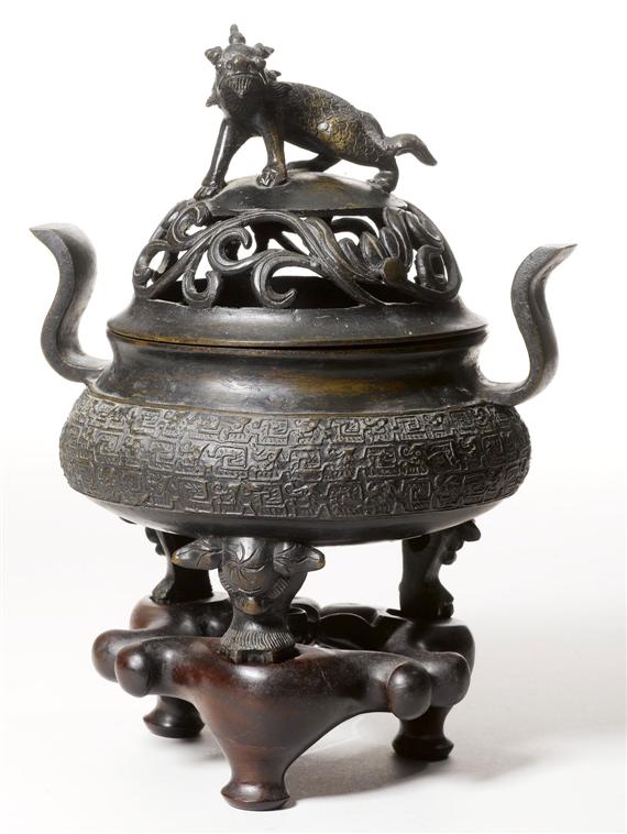 Appraisal: A BRONZE SMOKING BOWL WITH QILIN COVER China Qing dynasty