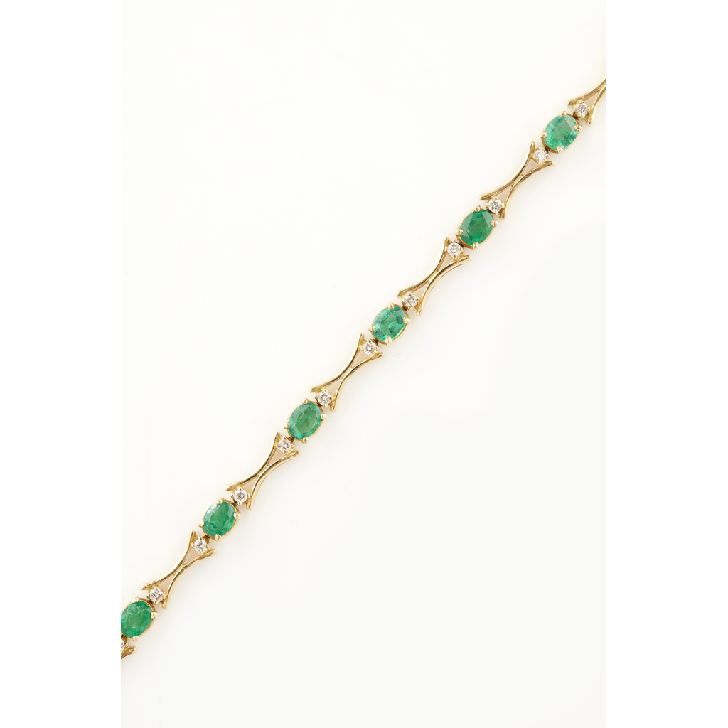 Appraisal: An emerald and diamond set bracelet composed of twelve claw