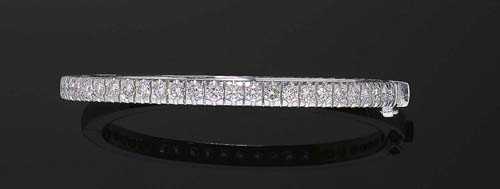 Appraisal: BRILLIANT-CUT DIAMOND BANGLE White gold Casual-elegant bangle the top is