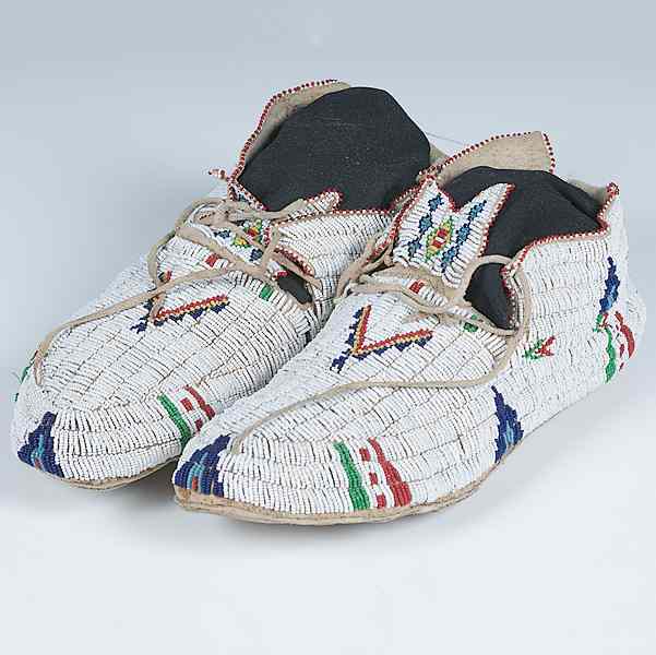 Appraisal: Cheyenne Beaded Hide Moccasins sinew-sewn and beaded using colors of