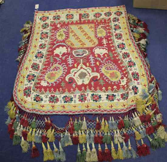 Appraisal: A Turkistan needlework saddle cover decorated with flowers and foliage