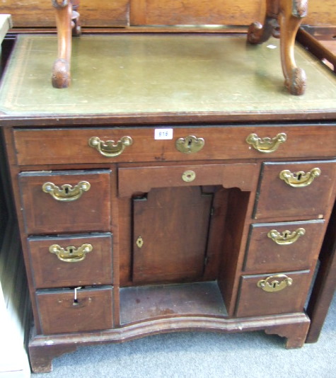 Appraisal: An th century Queen Anne style mahogany kneehole desk the