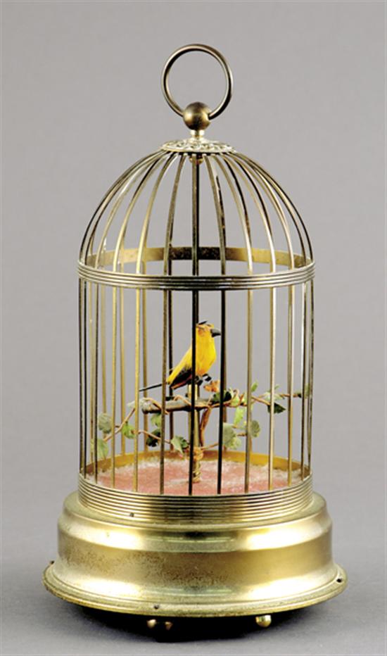 Appraisal: German musical bird automaton th centurybird perched in brass cage