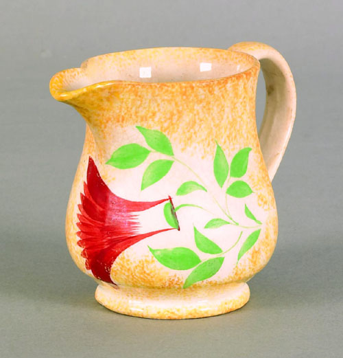 Appraisal: Yellow spatter creamer th c with thistle h