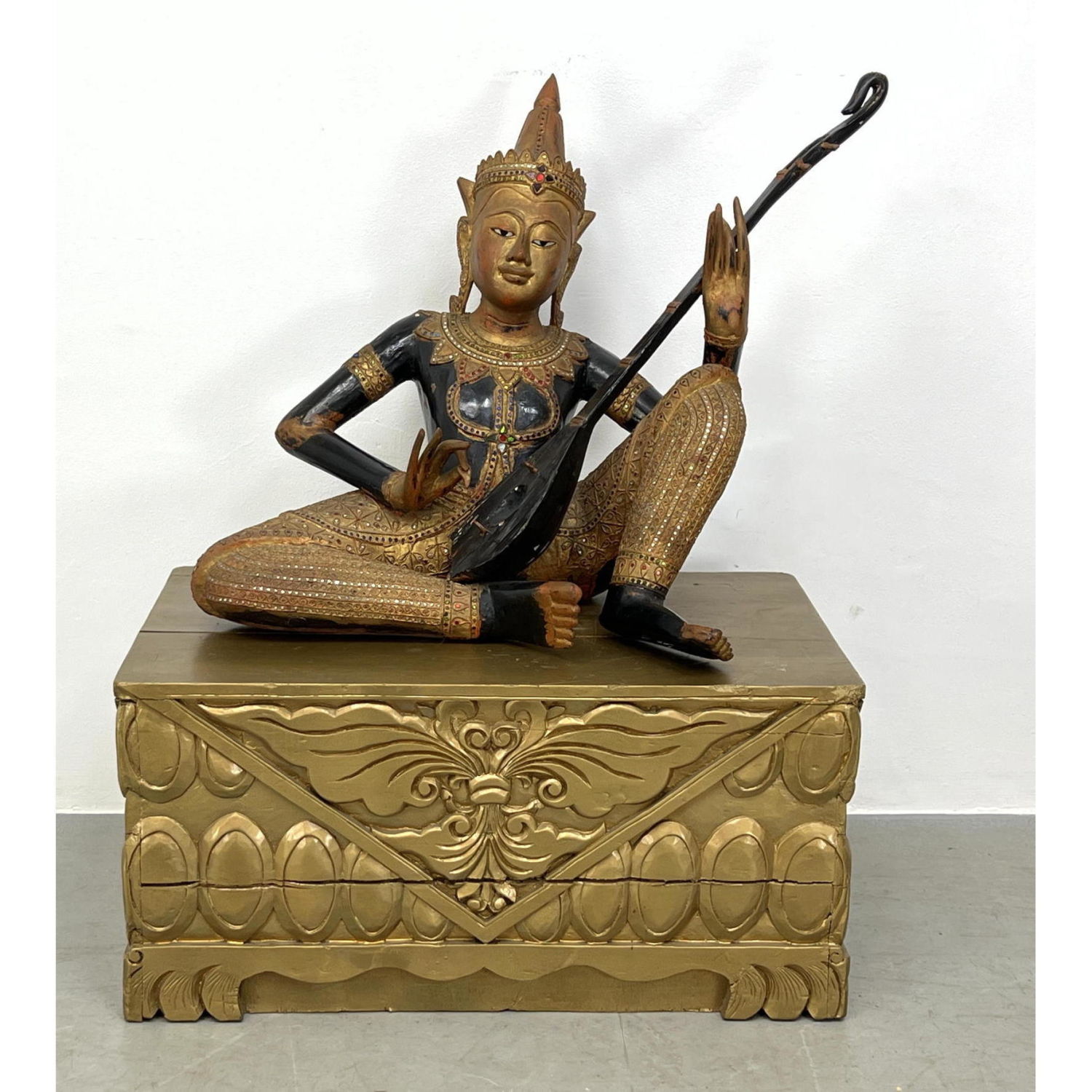 Appraisal: Carved and Painted Wood Thai Musician Gilt carved wood base