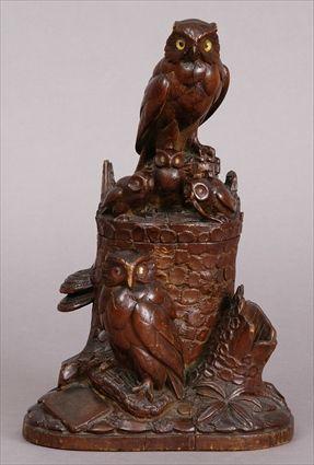 Appraisal: GERMAN CARVED WALNUT FIGURAL TOBACCO BOX Carved with adult owls