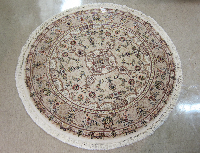 Appraisal: ROUND ORIENTAL WOOL AND SILK AREA RUG Indo-Persian floral and