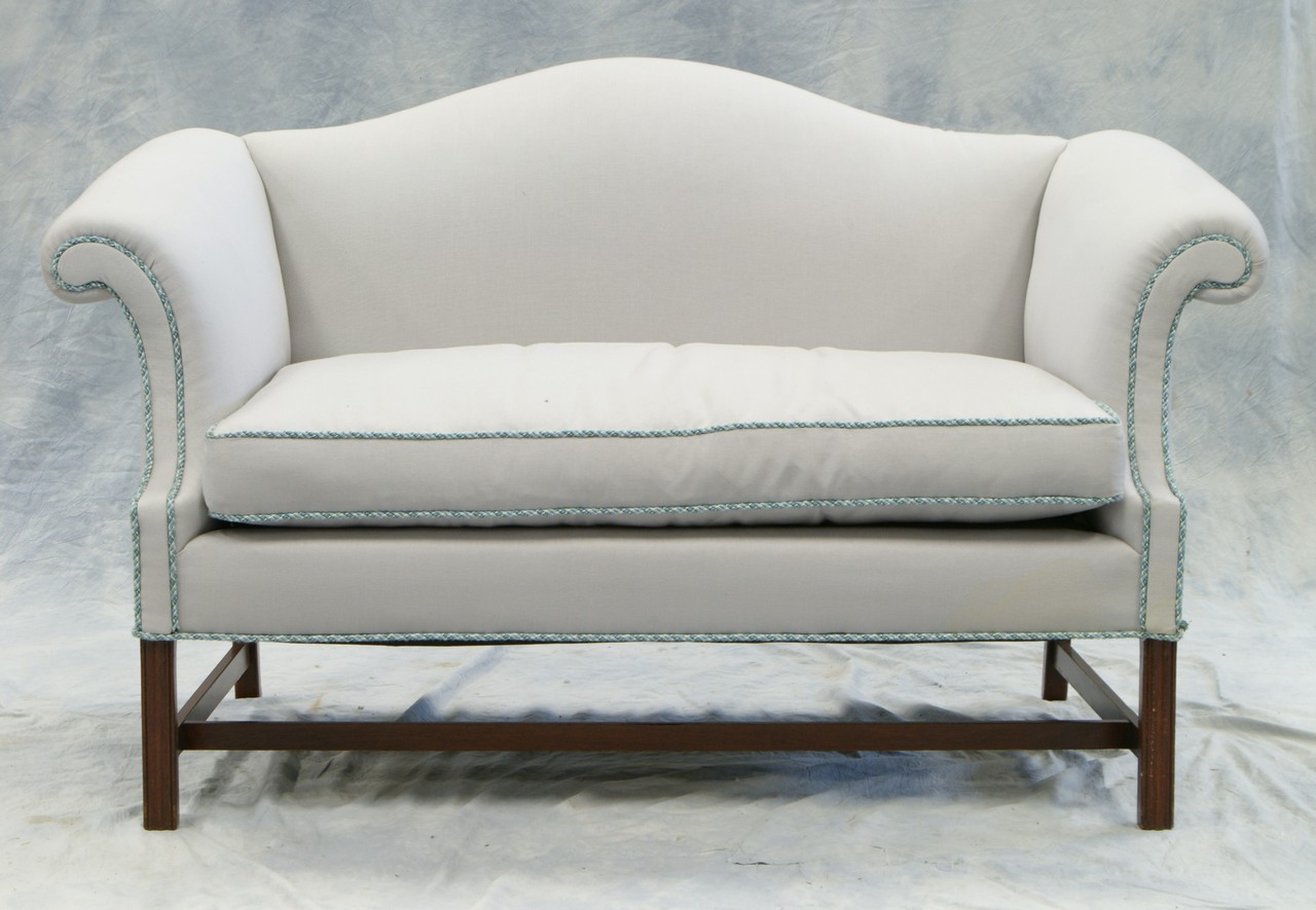 Appraisal: Mahogany Chippendale style camelback settee with molded legs stretcher base