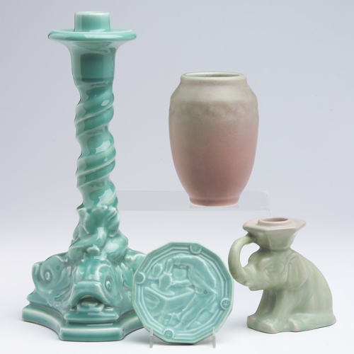 Appraisal: ROOKWOOD Four Production pieces tall candlestick with dolphin feet in