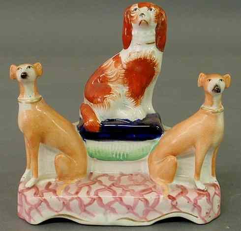 Appraisal: Staffordshire figural group th c of a spaniel on a