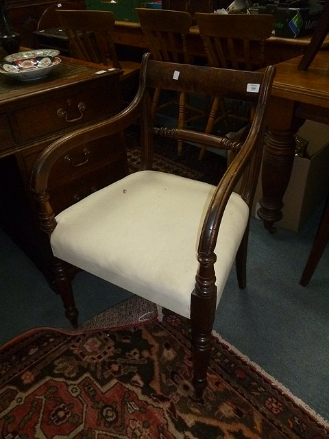 Appraisal: A REGENCY MAHOGANY CARVER ARMCHAIR with turned front legs