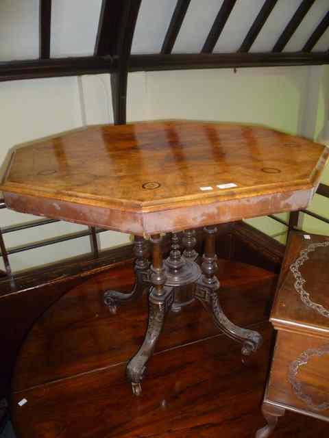 Appraisal: A VICTORIAN WALNUT CENTRE TABLE of octagonal form on carved