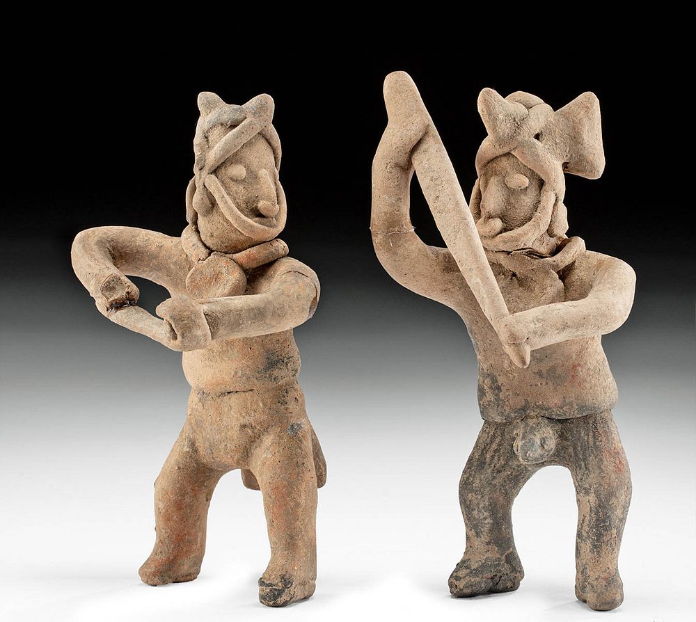 Appraisal: Two Colima Pottery Warrior Figures w Weapons Pre-Columbian West Mexico