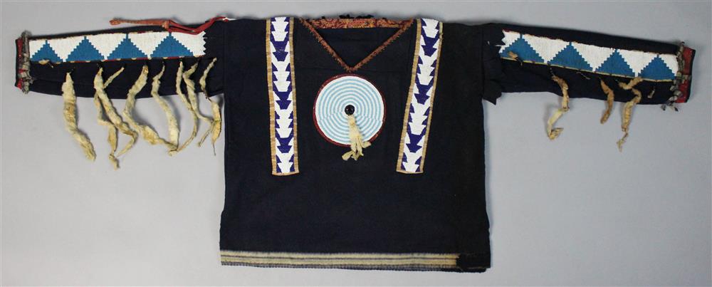 Appraisal: PLAINS BEADED TRADE CLOTH WAR SHIRT CROW constructed of blue