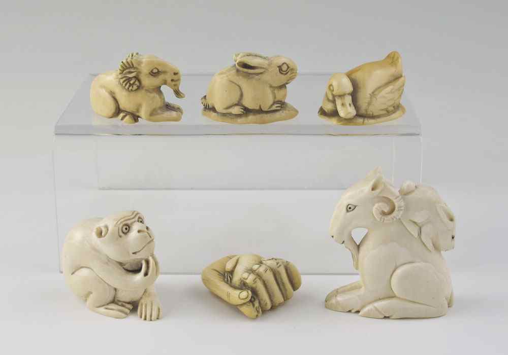 Appraisal: PIECE CARVED IVORY ANIMAL NETSUKE To include Goat with rabbit