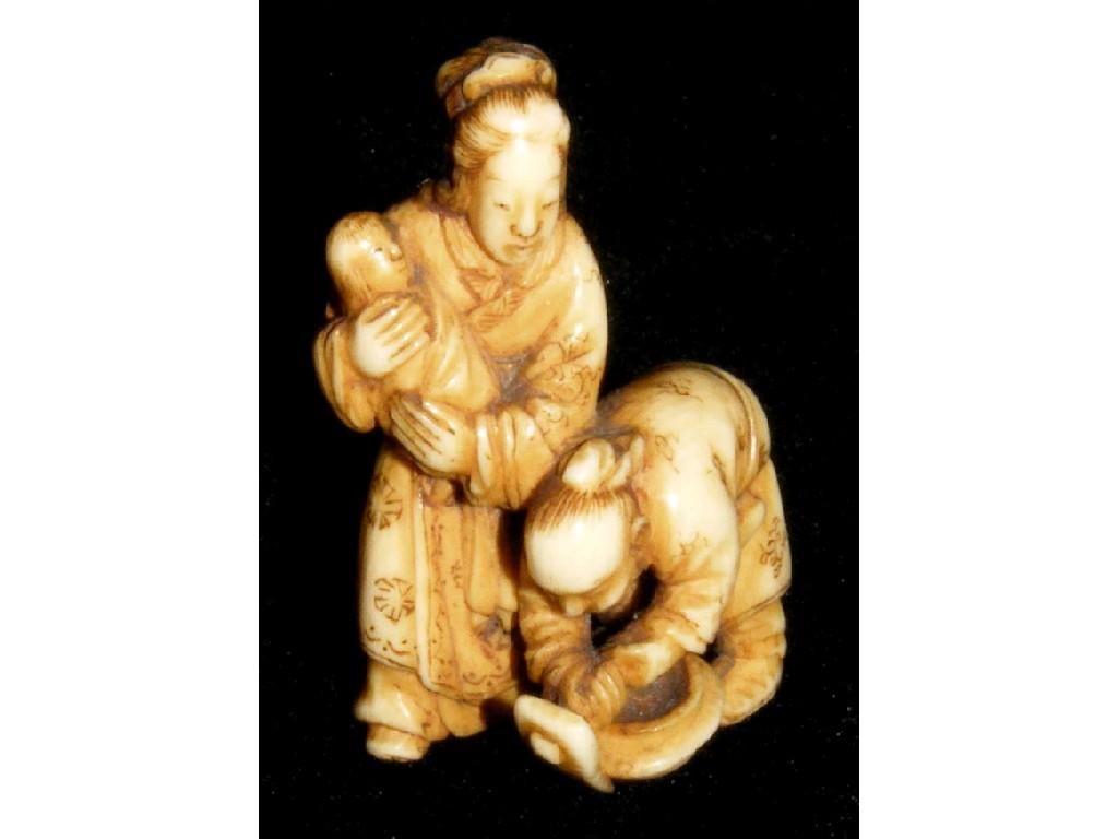 Appraisal: Good small ivory netsuke group by Tomochiki modelled with a