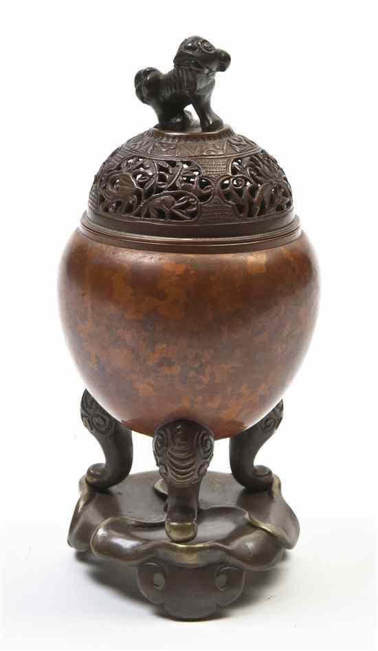 Appraisal: A Bronze Tripod Censer having a pierced domed lid with