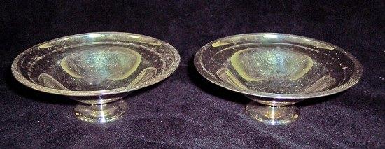 Appraisal: A pair of circular pedestal sweetmeat dishes with thread borders