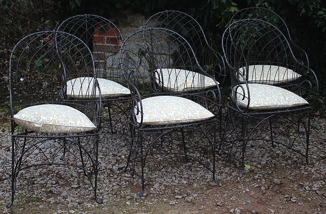 Appraisal: A SET OF SIX REGENCY STYLE WIREWORK GARDEN ARMCHAIRS with