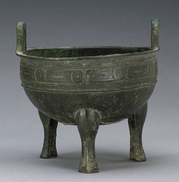 Appraisal: A cast bronze ding Western Zhou Period The shallow curving