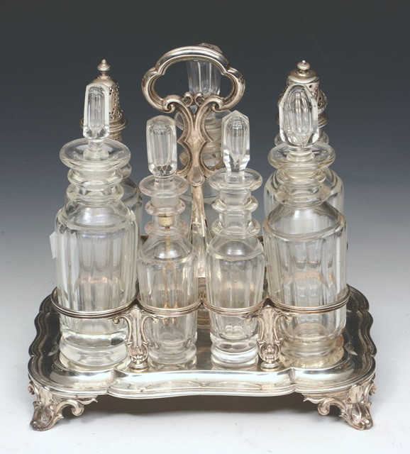 Appraisal: A SILVER SEVEN BOTTLE CRUET STAND of shaped rectangular form