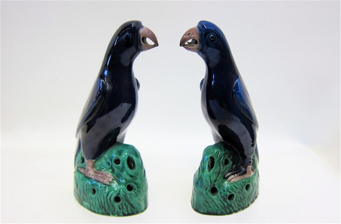 Appraisal: PAIR CHINESE POTTERY PARROT FIGURINES in opposing positions blue glaze