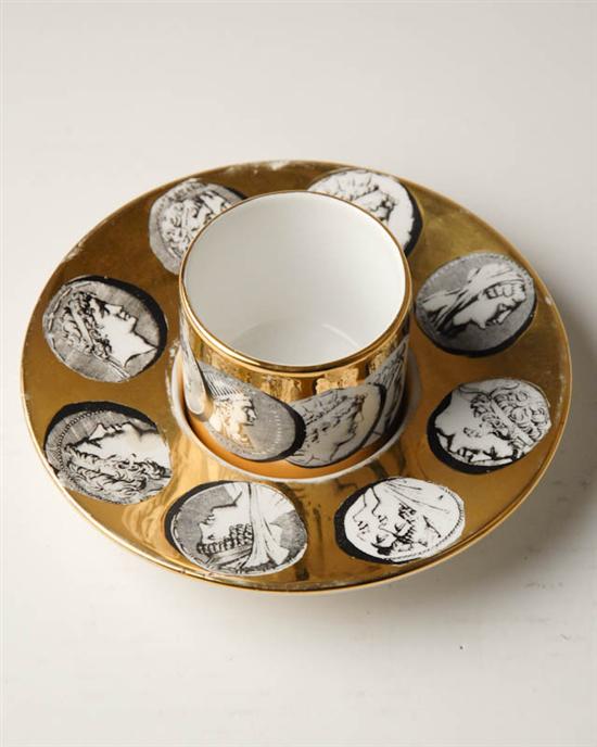 Appraisal: Fornasetti Handle-less Cup and Saucer signed Fornasetti-Milano made in Italy